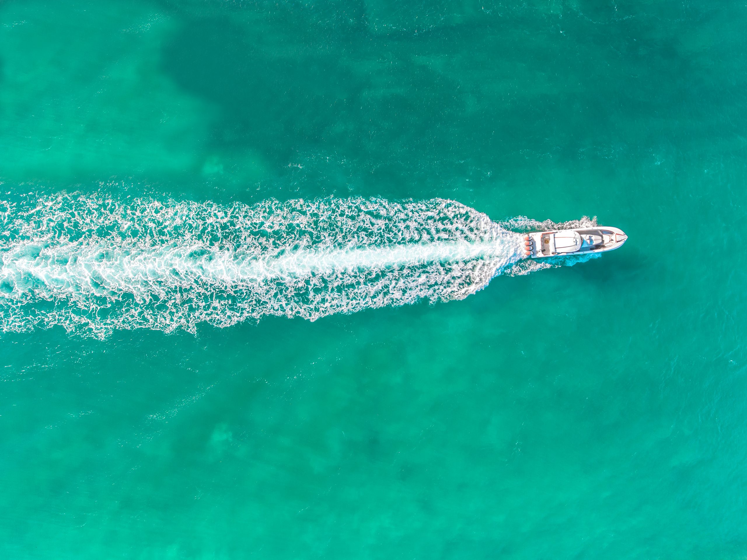 Boat Speeding Through Beautiful Blue Water Near Miami Beach